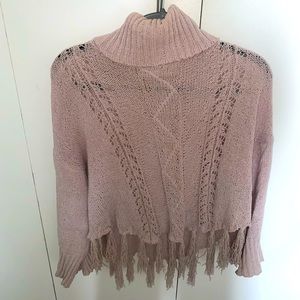 Light pink turtle neck. Not super heavy! Tassel bottom